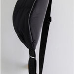 Free People  Bulls Eye Sling Bag. Color black. MSRP $40  Photo 3