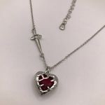 Boutique Elegant Silver Necklace with Red Heart and Dagger Chain Accent Photo 1