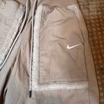Nike Womens XS Pants Medium High Rise Wind Jogger Loose Sherpa Trim Tan NWT Photo 1