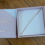 Origami Owl This is an  pearl strand bolo bracelet with Swarovski pearls in a rose gold tone.  Photo 0