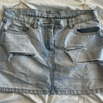 Light Blue Denim Mini Skirt with Distressed Details Size 2 Photo 0