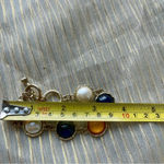 Multicolor bracelet orange, blue and white with gold Photo 4