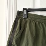 Athleta  Expedition Shorts Green Black Side Stripe Nylon Baggy Shorts 4 Photo 3
