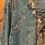 Gimmicks by BKE Gimmicks green lace up front blouse with bird butterfly floral pattern Photo 3