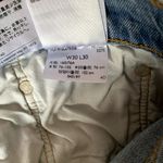 Levi's  501 Light Wash Raw Hem Skinny Jeans Photo 6