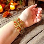 Kenneth Cole Gold-Tone Stretch Bracelet w/ Red & Amber Stones Photo 1