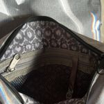 L.L.Bean  purse in gray. The lighting is from the sun through the door. No stains Photo 1