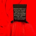 Stoosh || Coral long sleeve zipper up top with ruffled bottom Photo 4