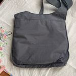 Baggallini  grey crossbody bag.  Many pockets Photo 8