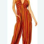 Free People Vibrant Striped Jumpsuit
Pit to Pit is 14” to 18” Photo 0