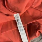 Lululemon  Rise and Flow Pant Mesh Criss Cross Size 4 Orange Coral EUC Photo 6