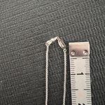 Elegant Silver Necklace with Rose Gold Accents Photo 4