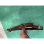 Ladies leather reversible belt black and brown with embellishments. Size med/30. Photo 2