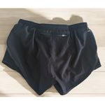 Nike Women's Black Dri Fit Tempo Embossed Running Shorts Zipper Pocket Small Photo 1