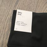 Nike  mid rise tight fit 7” length black dri fit shorts Photo 4