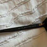 Versace | Stylish Black Sunglasses with Gold Accents Photo 3