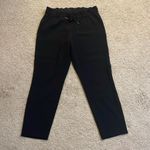 Lululemon  On the Fly 7/8 Pant *Woven - Black - Size 8 Photo 4