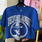 Elton John cut off T Photo 0