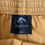Billabong mustard yellow drawstring shorts Photo 1