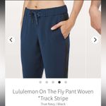 Lululemon  On The Fly Woven Track Black Stripe Pant in True Navy, Size 10 Photo 5