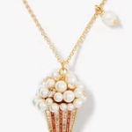 Kate Spade Carnival pendant showcases a faux pearl-embellished popcorn charm. Photo 0