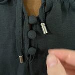 Free People  black Ruffle me up ruffled smocked detail front tie top size S Photo 11