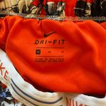Nike Women’s  Dri-fit Orange blue and white floral print lined athletic shorts M Photo 2