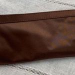 Avon NWOT Y2k chocolate brown clutch with floral design. Photo 1
