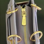 Trina Turk double handle tote in lilac with a removable crossbody strap Photo 10