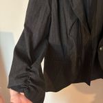 B. Wear  black striped puff sleeve blazer Photo 2