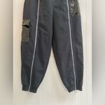 Nike  Sportwear Icon Clash Pants in Black Zippered Leg Pocket Detail Size M Photo 7