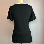 L8ter  black top crochet lace neckline fitted bust flares out at the hips Size M Photo 2