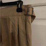 Timeless form tan pants. Buckles on waist. Size 28 Photo 1