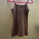 Nike one piece jumpsuit with tape detail in beige Photo 7