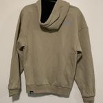 The North Face  women XS hooded sweater tan color with reflective lines Photo 6