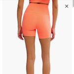 FP Movement Never Better Bike Shorts in Neon Coral Size S Orange Photo 1