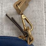 Charming Charlie small blue crossbody bag with tan strap. Photo 1