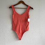 Free People Intimately Clean Lines Bodysuit EmberGlow Papaya Size M/L NWT Photo 1