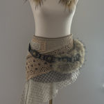 Cream asymmetrical skirt with intricate patchwork net pattern design White Photo 0