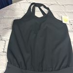 Edara NWT  The Signature Ruffle Dress Size Small . This one does not come with the sport bra as seen on the stock picture.   The criss-cross back of the Ruffle Dress gives non-restrictive mobility and is effortless to pull on and take off. A wide waistband anchors the relaxed fit of the bodice, which drapes loosely to create a flattering and comfortable midsection for diverse body types. Pair this dress with an Advantage Sports Bra and coordinating Ace Visor for a complete, finished look. Photo 12