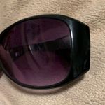 Black sunglasses with red, white, and black design Photo 1