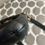 Coach Black Crossbody Bag with Adjustable Strap and Flap Closure Photo 9