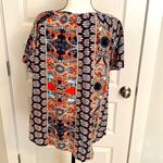 Angashion | Navy/burnt orange print short sleeve scoop neck top with tie accent. Photo 4
