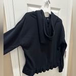 Free Press  flirty ruffle bottom hoodie black size Medium Photo 3