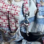 Ėāā§ź°į 90's embroidered teddy bear denim bag with adjustable straps and wooden closure ą»ź± ā§āĖ Blue Photo 3