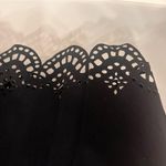 Kendall + Kylie NWT  Black Sleeveless Top with laser cutout at hem. Photo 2