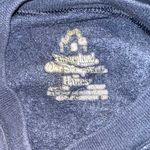 Disney A cozy long-sleeve Disneyland sweatshirt in dark blue featuring Mickey Mouse on the front. Comfortable, cute, and perfect for everyday wear. Size: Small. Photo 1