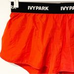 Ivy Park  Women's Medium Red Active Logo Taped Mesh Lined Woven Running Shorts Photo 2