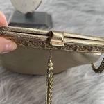 Vintage gold shimmering faux leather glam handbag with tassel. Gold Photo 9