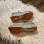 Brooks Women's Glycerin 20 neutral running shoe in a light gray, teal, and coral Photo 6